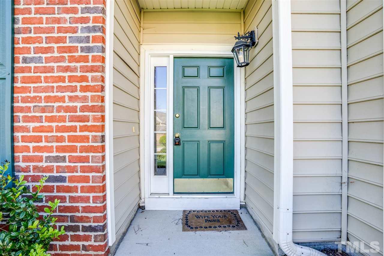 11115 Maplecroft Court Raleigh, NC 27617 - Photo 2 of 25 a view of a brick house with a window