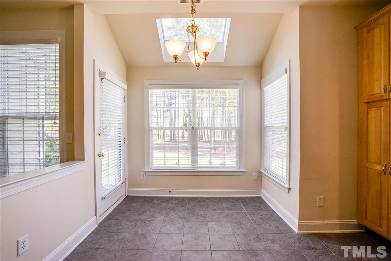 11115 Maplecroft Court Raleigh, NC 27617 - Photo 11 of 25 a view of an empty room with a window