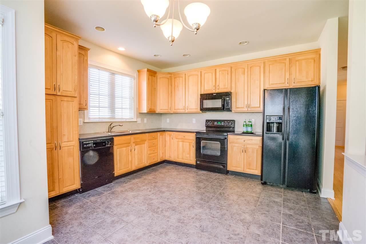 11115 Maplecroft Court Raleigh, NC 27617 - Photo 12 of 25 a kitchen with stainless steel appliances a refrigerator sink and microwave