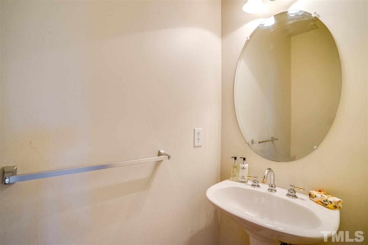 11115 Maplecroft Court Raleigh, NC 27617 - Photo 17 of 25 a bathroom with a sink and a mirror