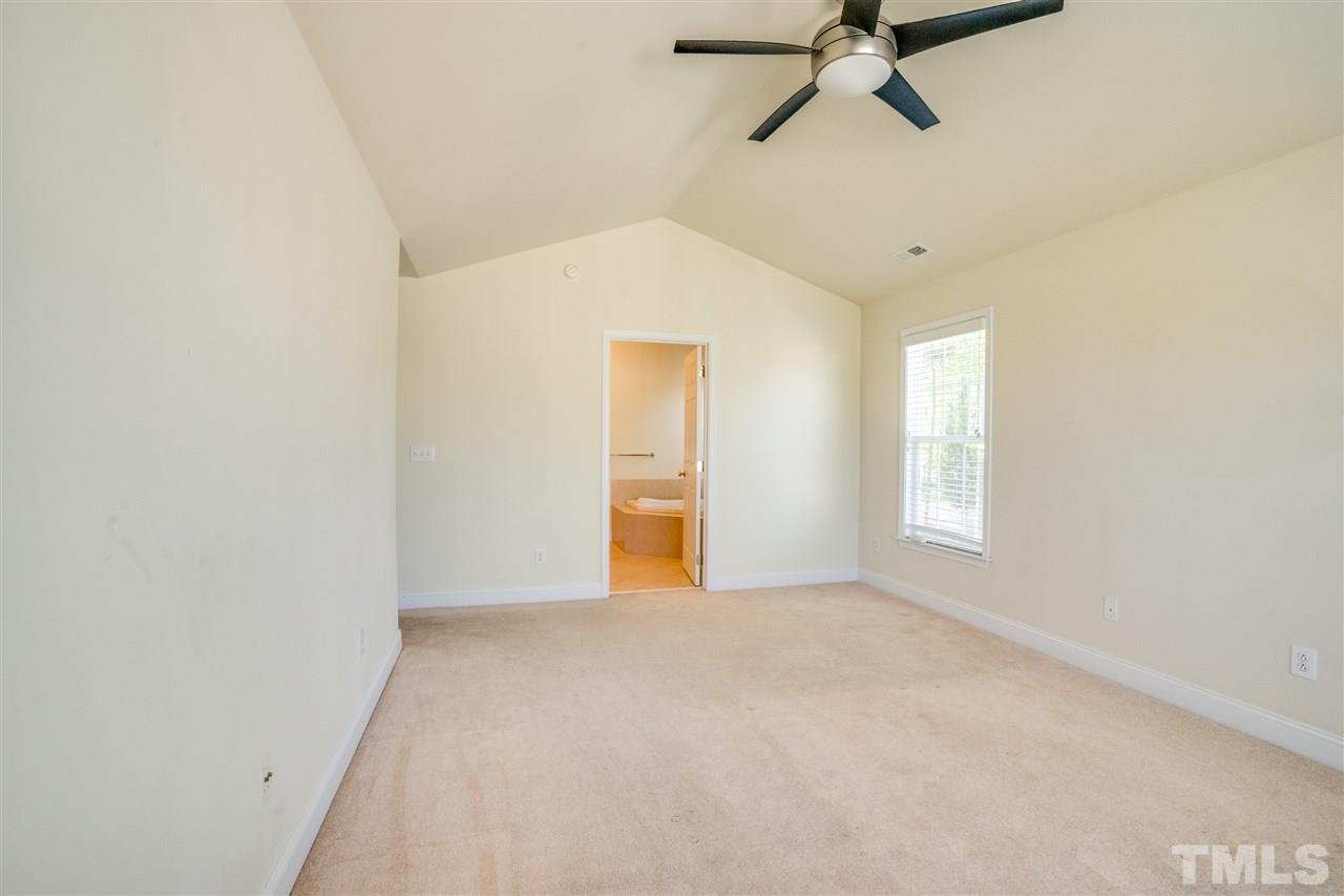 11115 Maplecroft Court Raleigh, NC 27617 - Photo 20 of 25 a view of a livingroom with a ceiling fan and window