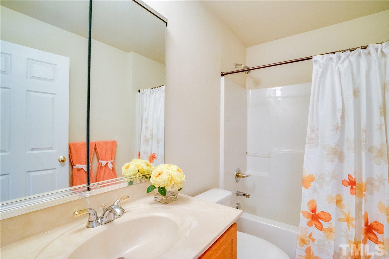 11115 Maplecroft Court Raleigh, NC 27617 - Photo 23 of 25 a bathroom with a sink and a mirror