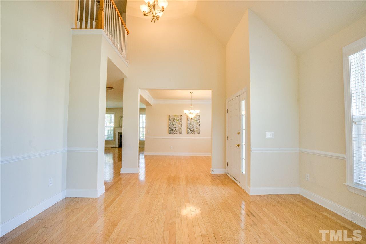 11115 Maplecroft Court Raleigh, NC 27617 - Photo 6 of 25 a view of hallway with wooden floor