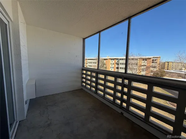 a view of an empty room with a large window