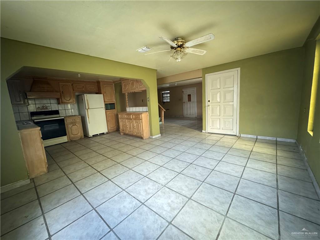 1306 North Rau-Con Street Roma, TX 78584 - Photo 11 of 34 a view of an empty room and kitchen with window