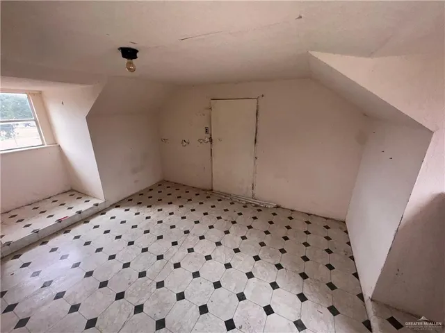 a stove top oven sitting inside of a kitchen