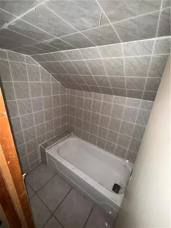 a bathroom with a sink a mirror and a shower