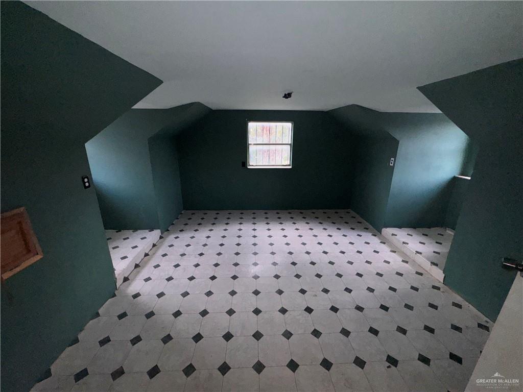 1306 North Rau-Con Street Roma, TX 78584 - Photo 33 of 34 a bathroom with a black white checkered floor