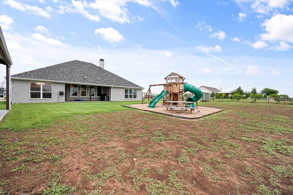 6365 Rhoden Avenue Godley, TX 76044 - Photo 28 of 31 a house view with a garden space