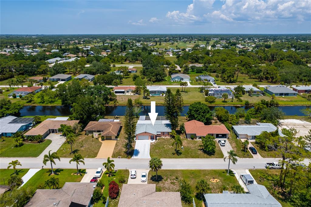 231 Caddy Road Rotonda West, FL 33947 - Photo 1 of 24 an aerial view of residential houses with outdoor space