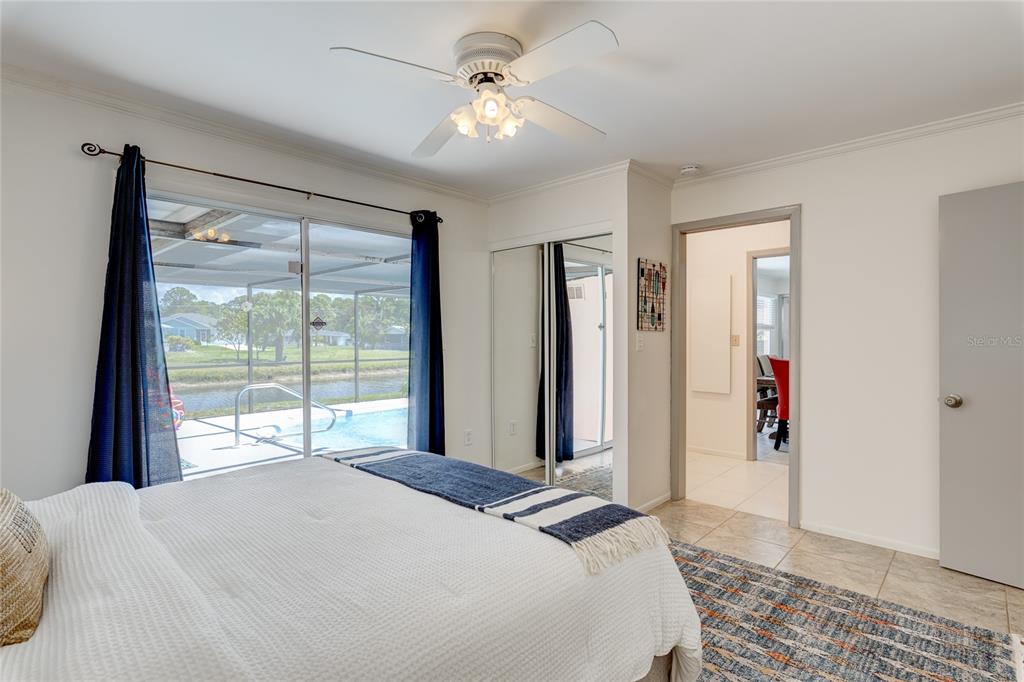 231 Caddy Road Rotonda West, FL 33947 - Photo 16 of 24 a bedroom with a large bed and a window