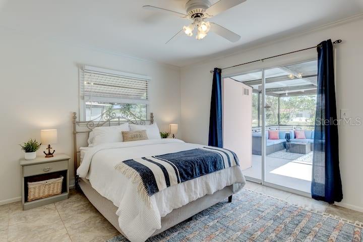 231 Caddy Road Rotonda West, FL 33947 - Photo 17 of 24 a bedroom with a large bed and a window