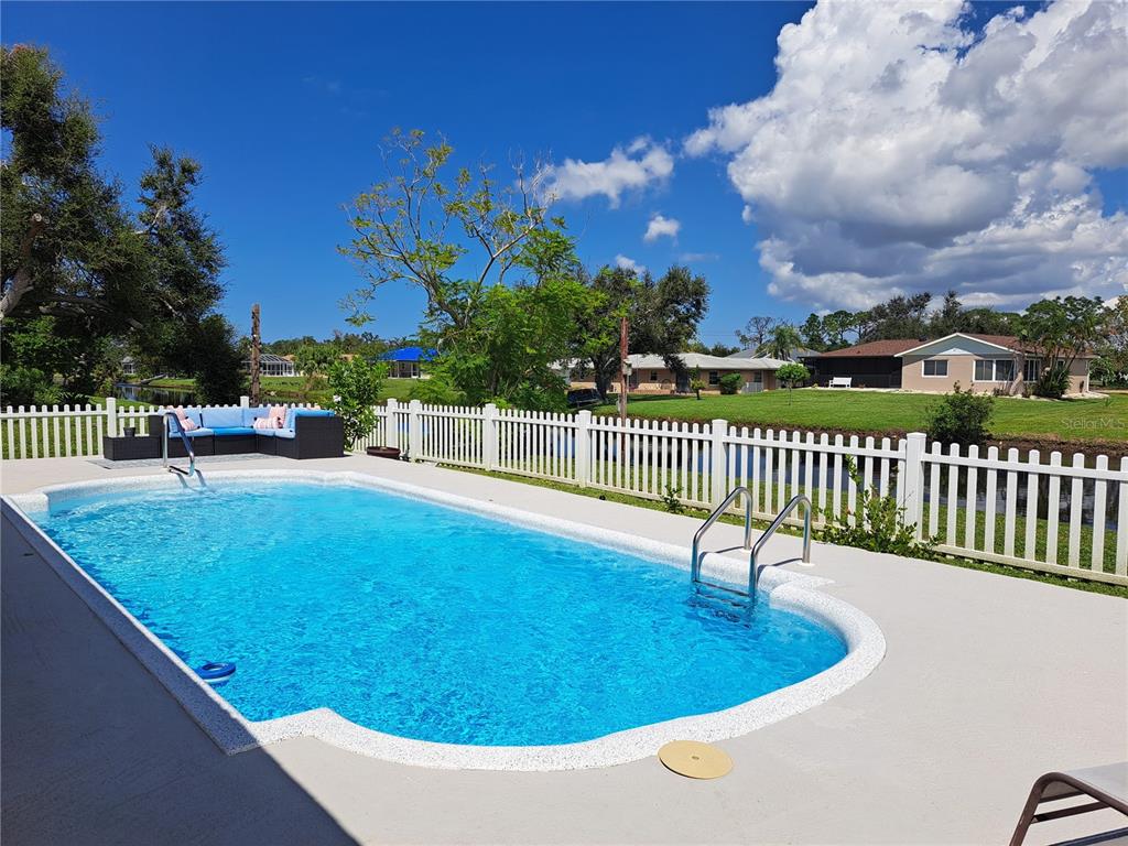 231 Caddy Road Rotonda West, FL 33947 - Photo 2 of 24 a view of a balcony with a patio