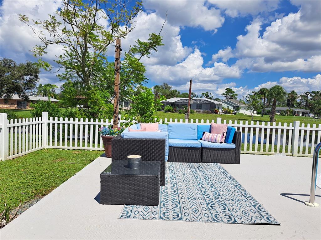 231 Caddy Road Rotonda West, FL 33947 - Photo 22 of 24 a view of a bench in the garden