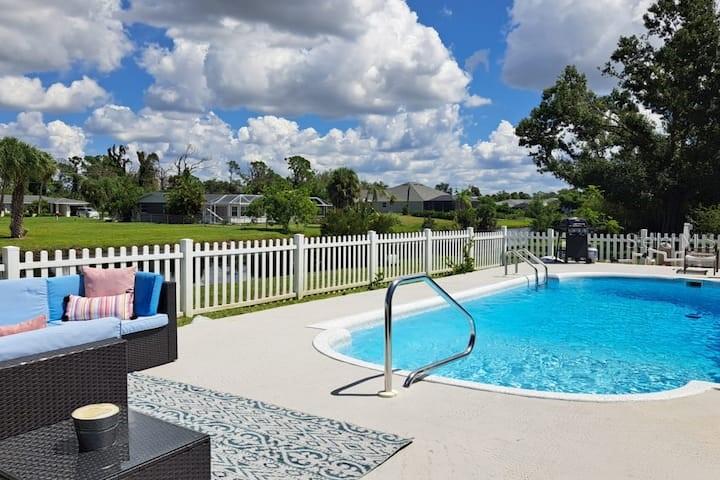 231 Caddy Road Rotonda West, FL 33947 - Photo 3 of 24 a view of a swimming pool with a patio