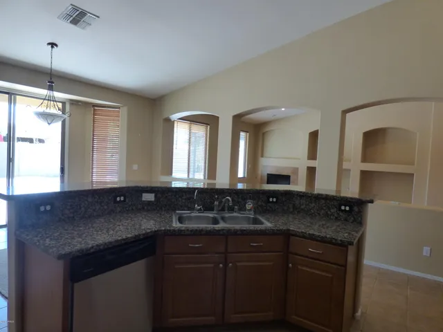 a view of a room with a ceiling fan