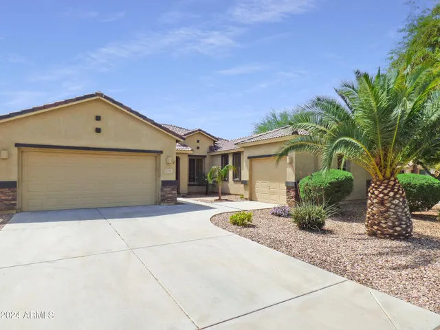 a view of an empty room with a window and fireplace