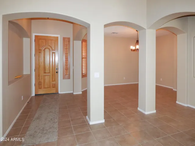 a view of a livingroom with a kitchen
