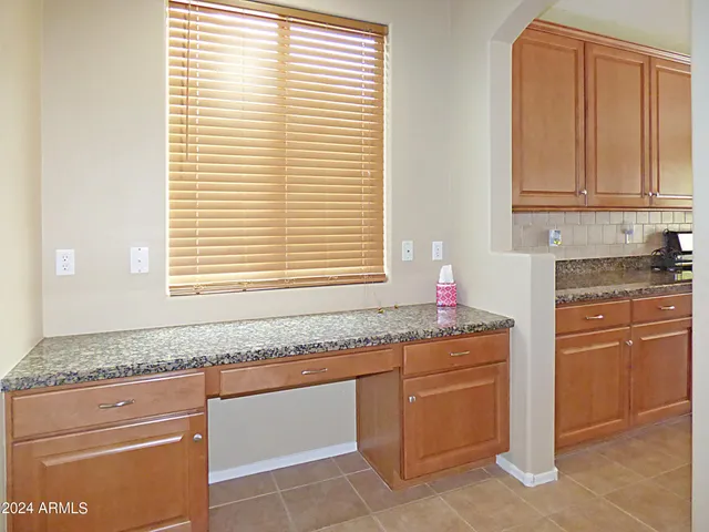 a view of a room with a ceiling fan