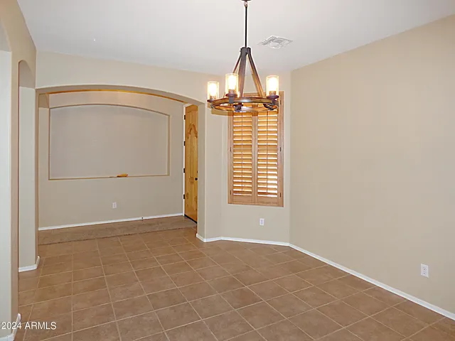a bathroom with a sink vanity and mirror