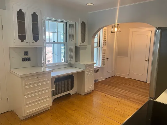 a bathroom with a sink a mirror and a shower