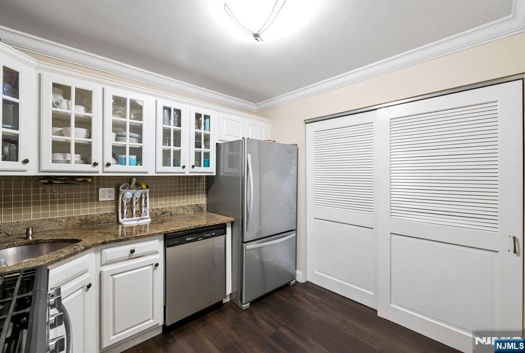1034 Castle Road Mahwah, NJ 07430 - Photo 11 of 21 a kitchen with a refrigerator stove and sink