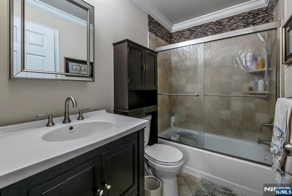 1034 Castle Road Mahwah, NJ 07430 - Photo 13 of 21 a bathroom with a sink mirror vanity and toilet