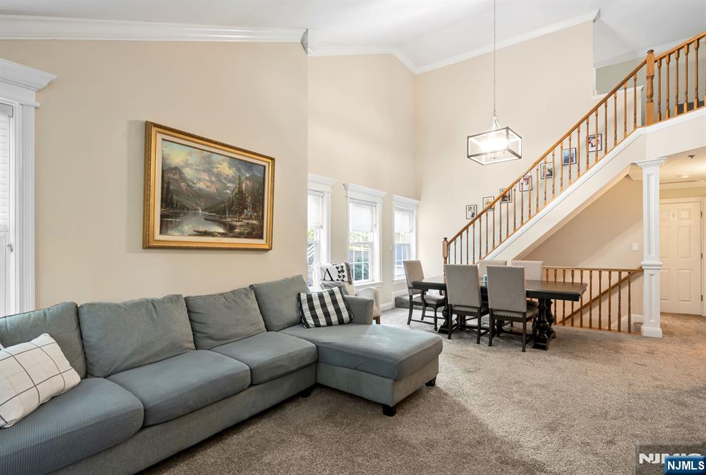 1034 Castle Road Mahwah, NJ 07430 - Photo 3 of 21 a living room with furniture or stairs and a couch