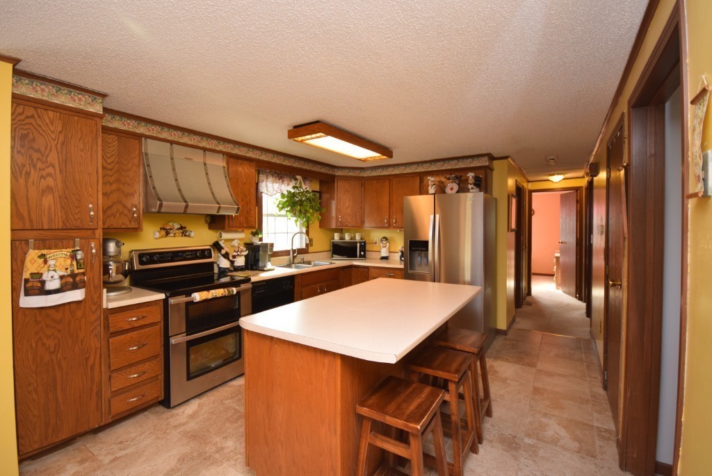 35 Driftwood Road Springfield, MA 01128 - Photo 3 of 26 a kitchen with granite countertop a refrigerator stove top oven and sink