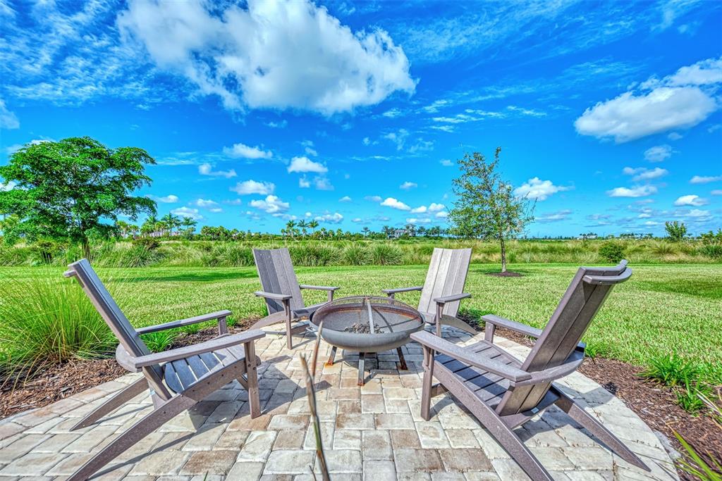 8216 Summer Night Road Sarasota, FL 34241 - Photo 26 of 60 a view of a chairs and table in patio