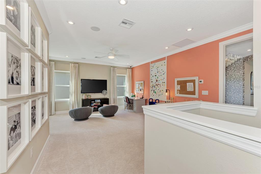 8216 Summer Night Road Sarasota, FL 34241 - Photo 29 of 60 a living room with furniture and a flat screen tv