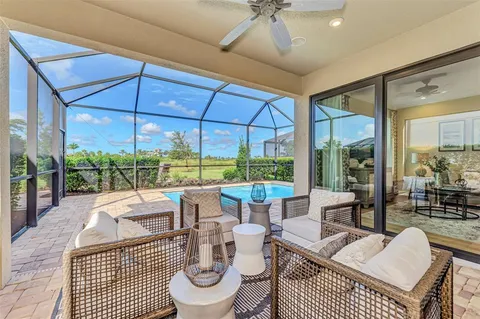 a view of a dining room with furniture wooden floor and chandelier