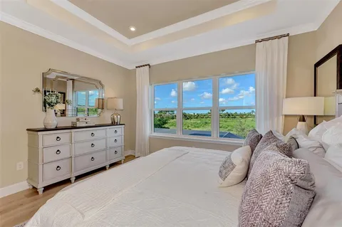 a white bath tub sitting next to a bathroom