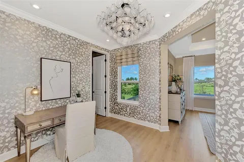 a living room with a bed furniture and a window