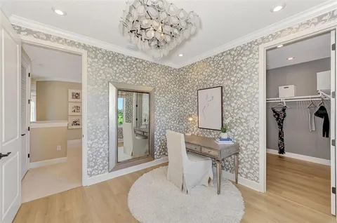 a bedroom with a bed and a lamp on table