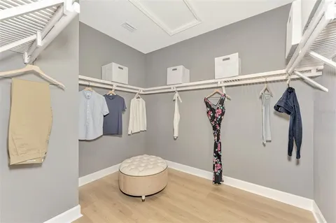 a bathroom with a sink a toilet a mirror and bathtub