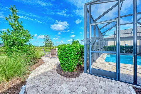 a view of a pathway with a yard