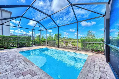 a view of swimming pool with a patio