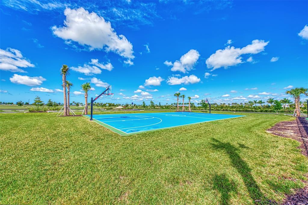 8216 Summer Night Road Sarasota, FL 34241 - Photo 56 of 60 a view of a golf course with a swimming pool
