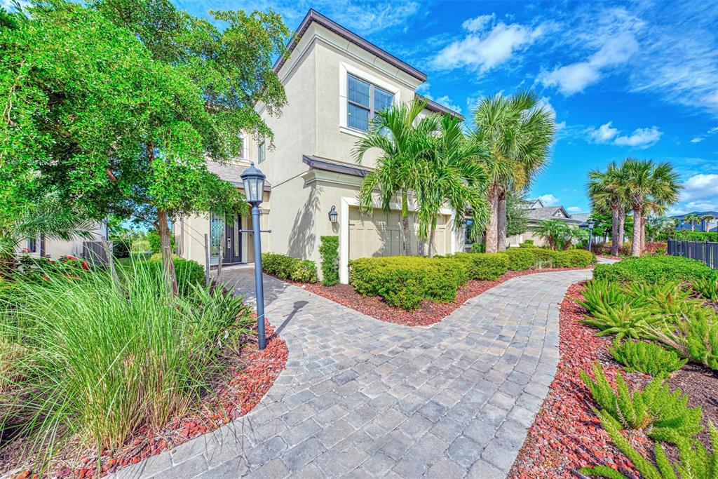 8216 Summer Night Road Sarasota, FL 34241 - Photo 6 of 60 a view of a garden with a house