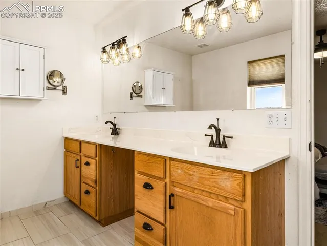 a bathroom with a sink double vanity and a mirror
