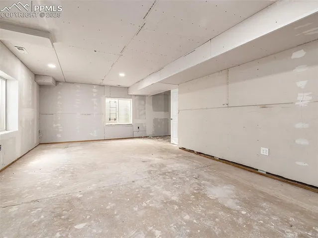 an empty room with windows