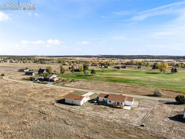 a view of a lake with a yard