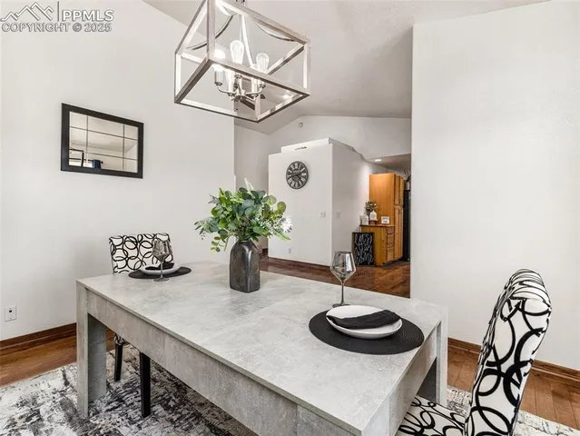 a table with a vase and flowers on it