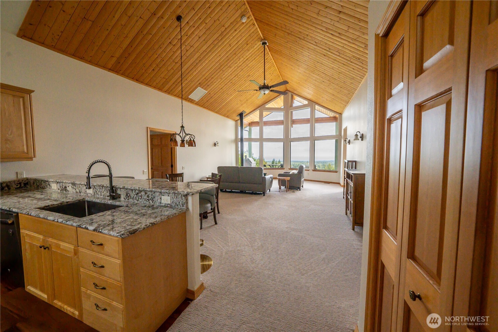 212 Maletti Hill Road Port Angeles, WA 98362 - Photo 14 of 37 a kitchen that has a lot of cabinets in it