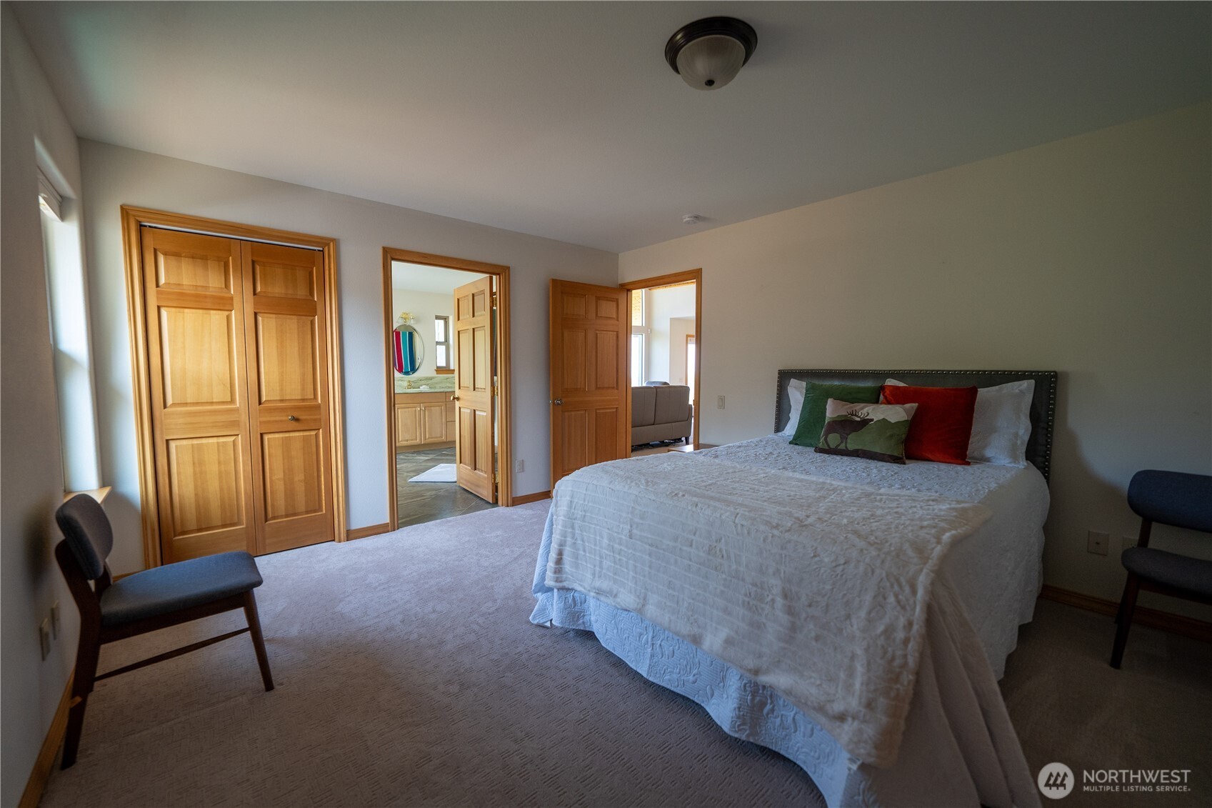 212 Maletti Hill Road Port Angeles, WA 98362 - Photo 18 of 37 a bedroom with a bed and a couch