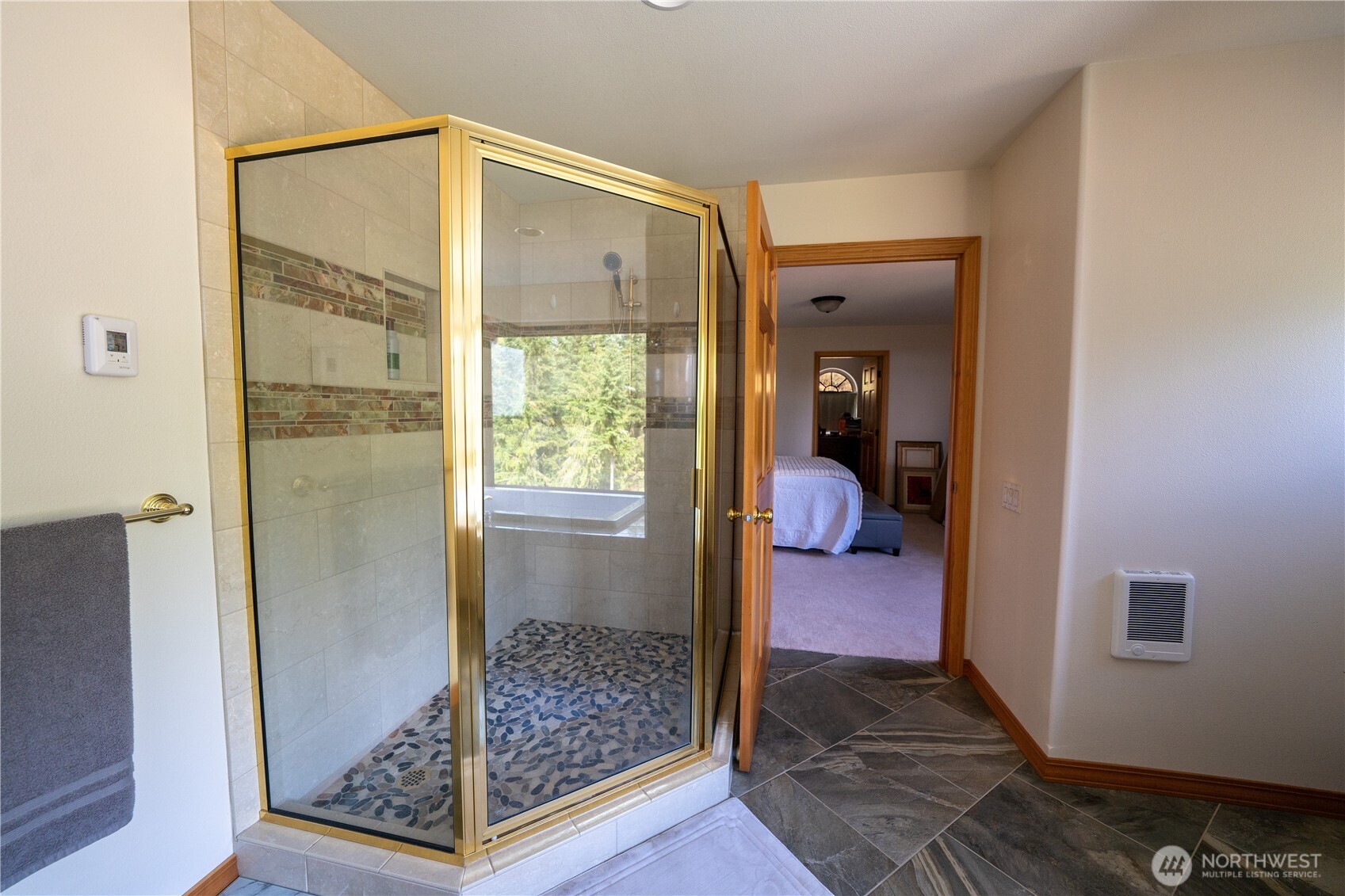 212 Maletti Hill Road Port Angeles, WA 98362 - Photo 19 of 37 a bathroom with a glass shower door
