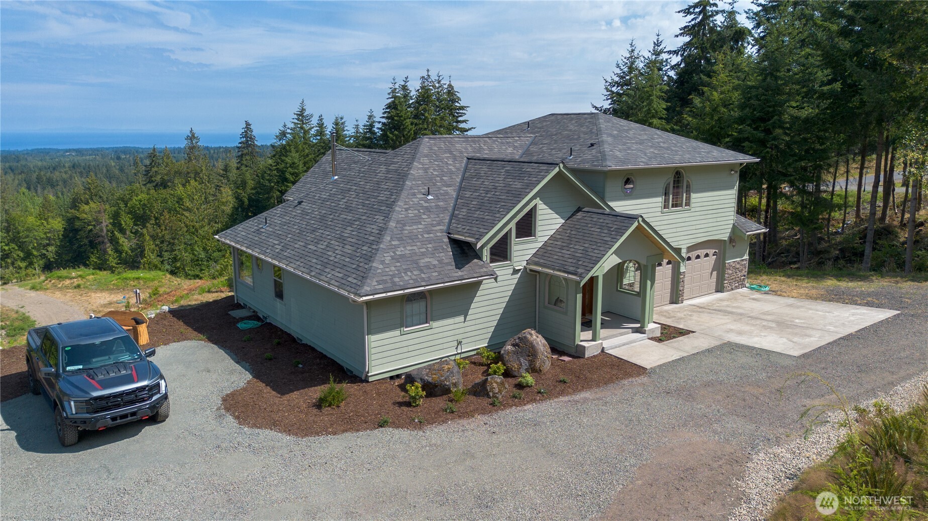 212 Maletti Hill Road Port Angeles, WA 98362 - Photo 2 of 37 an aerial view of a house with swimming pool garden and patio