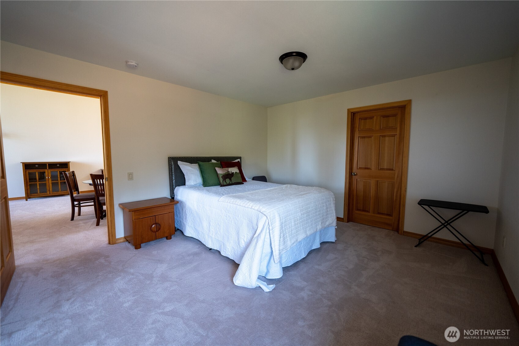 212 Maletti Hill Road Port Angeles, WA 98362 - Photo 22 of 37 a spacious bedroom with a bed and a couch