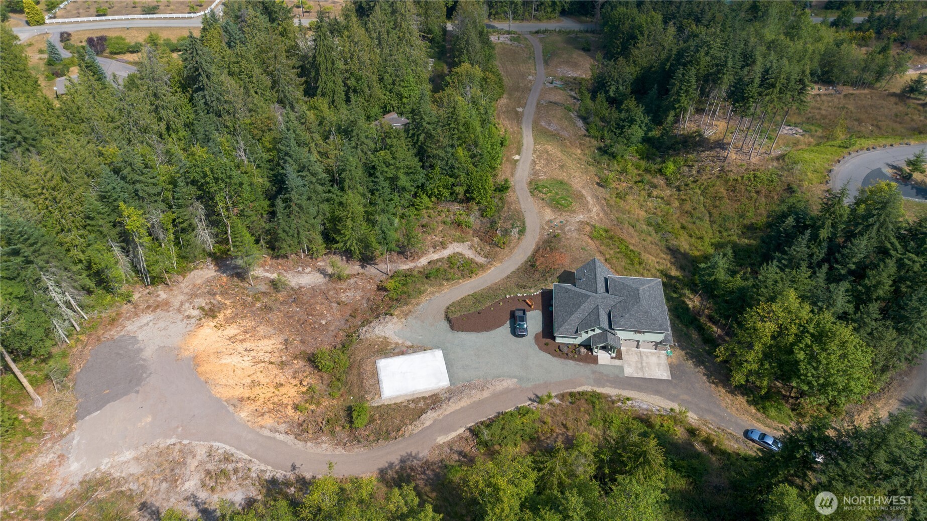 212 Maletti Hill Road Port Angeles, WA 98362 - Photo 30 of 37 an aerial view of a house with a yard and trees